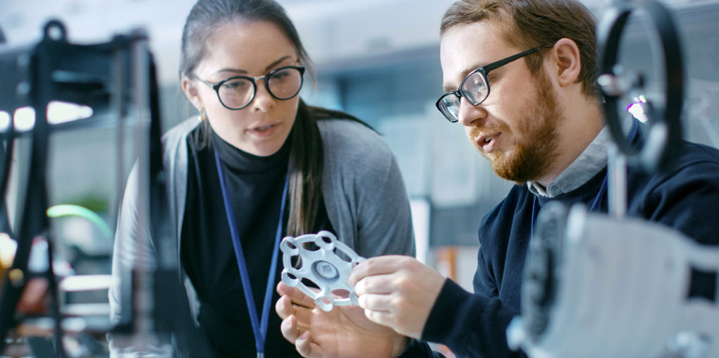 Engineers discussing prototyping parts